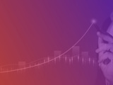 orange and purple gradient growth chart with hand pointing at growth line